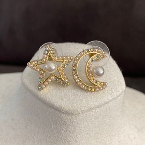 Treasured jewels star and moon earrings.